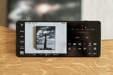The interface in P Mode resembles that of a large Sony Alpha in landscape mode.